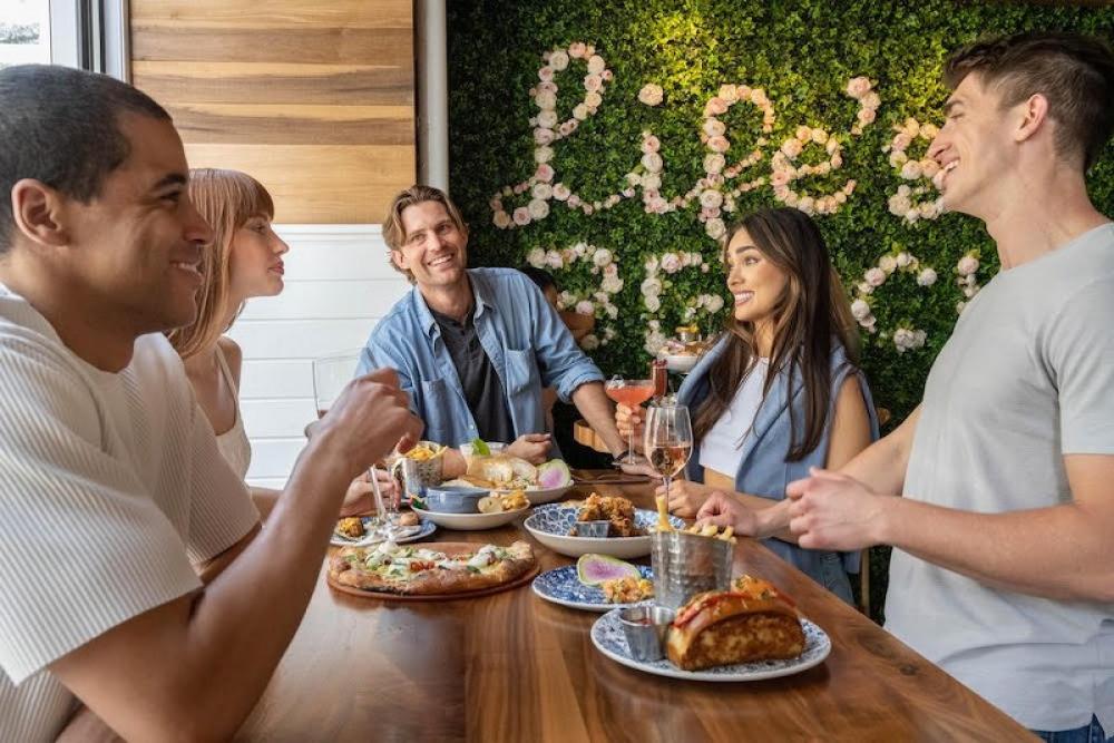 The Hampton Social is the perfect spot for friends to gather over hearty seafood dishes. Photo: Official FB 