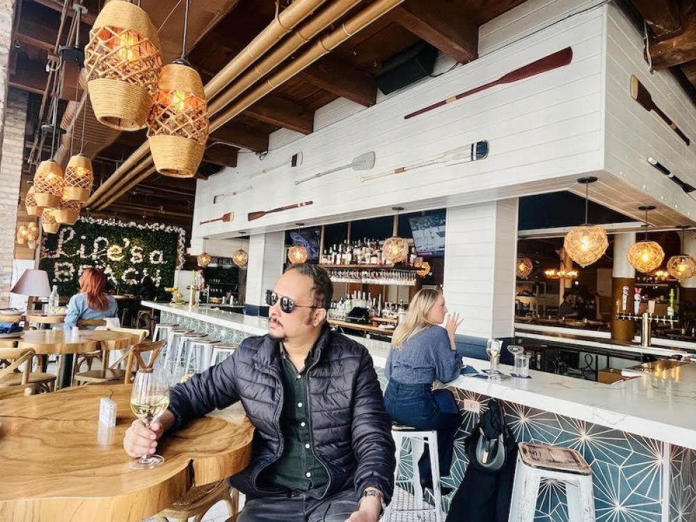 Yours truly savoring summer vibes, one glass at a time at The Hampton Social. Photo: Yogesh Tyagi 